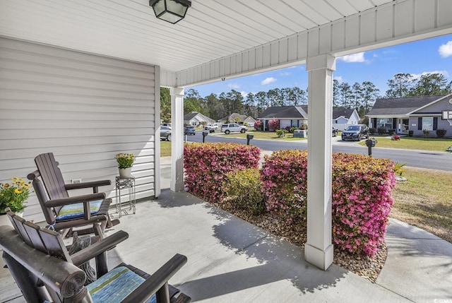 view of patio featuring a residential view and covered porch