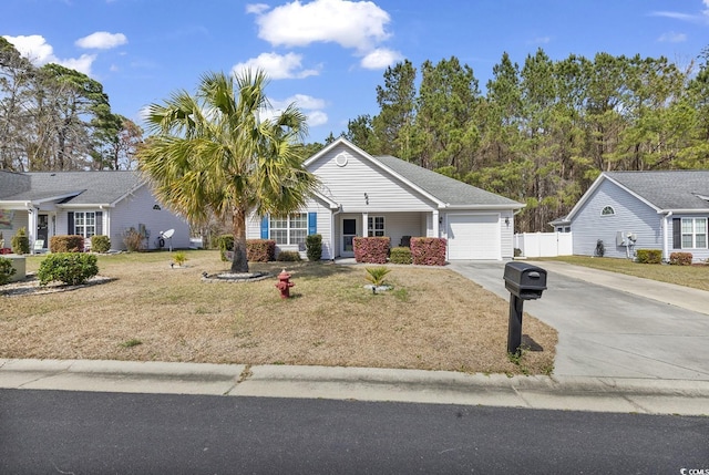 ranch-style home with a garage, driveway, a front lawn, and fence