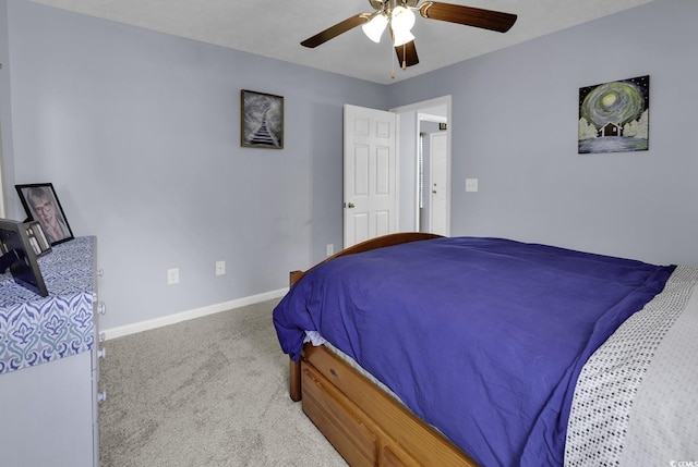 carpeted bedroom with baseboards and ceiling fan