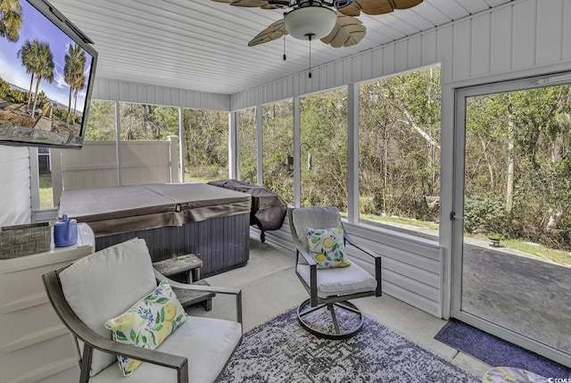 sunroom featuring a wealth of natural light, ceiling fan, and a jacuzzi