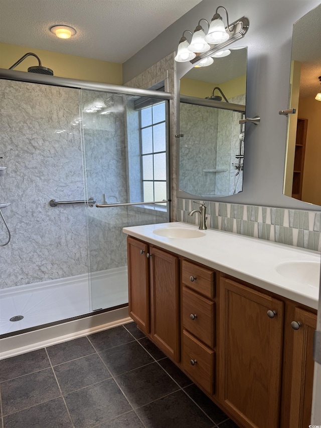 1205 Woodruff Ct, Conway, SC 29526 - bathroom with a stall shower, double vanity, tile patterned flooring, and a textured ceiling