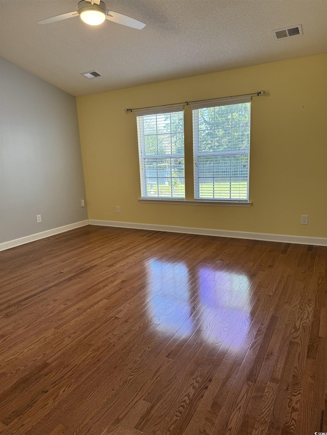 1205 Woodruff Ct, Conway, SC 29526 - unfurnished room with dark wood-style flooring, ceiling fan, baseboards, and a textured ceiling