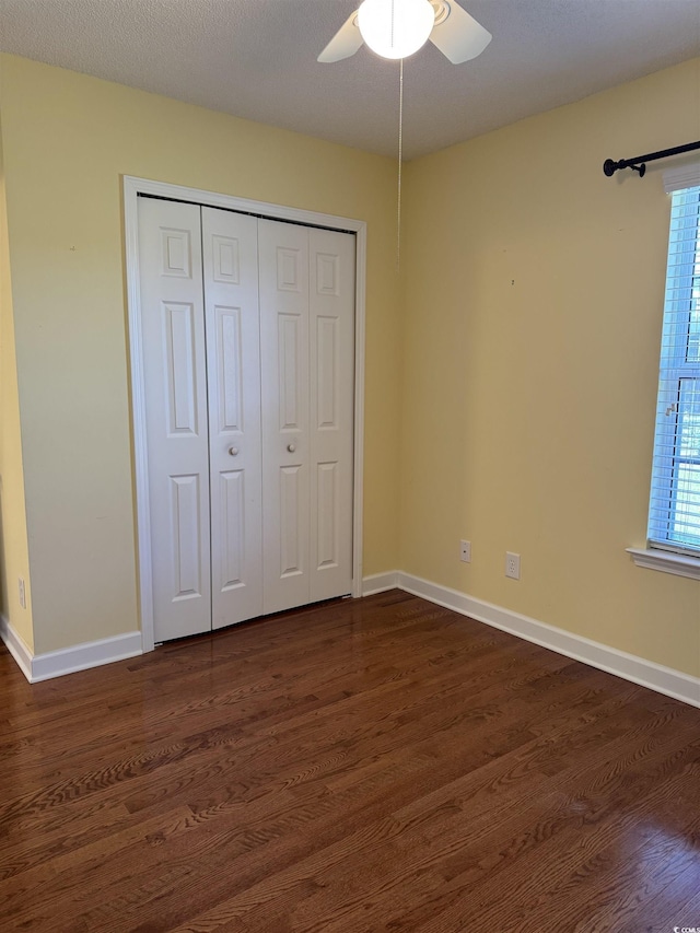 1205 Woodruff Ct, Conway, SC 29526 - unfurnished bedroom with dark wood-type flooring, a closet, and baseboards