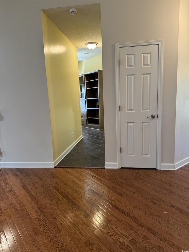 1205 Woodruff Ct, Conway, SC 29526 - corridor featuring baseboards, dark wood finished floors, and a textured ceiling