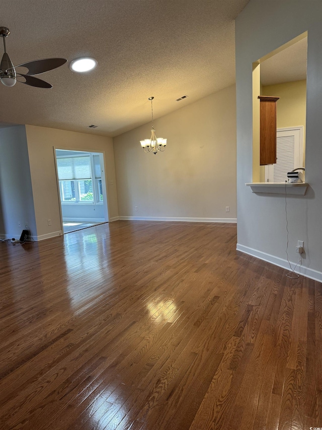 1205 Woodruff Ct, Conway, SC 29526 - unfurnished living room featuring ceiling fan, a textured ceiling, a chandelier, dark wood-type flooring, and baseboards