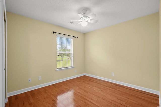 1205 Woodruff Ct, Conway, SC 29526 - empty room with wood finished floors, a textured ceiling, and ceiling fan