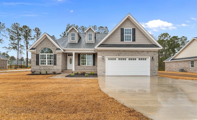 3329 Hughes Gasque Rd, Aynor, SC 29511 - view of front of home featuring brick siding, concrete driveway, and a shingled roof