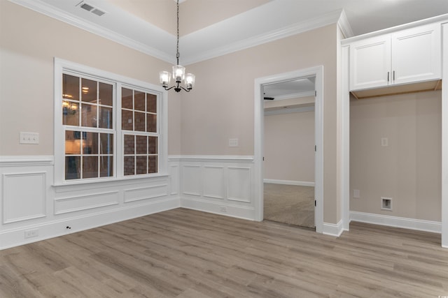 3329 Hughes Gasque Rd, Aynor, SC 29511 - unfurnished dining area featuring a chandelier, ornamental molding, light wood-style flooring, and a wainscoted wall