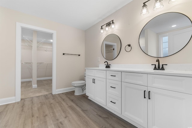 3329 Hughes Gasque Rd, Aynor, SC 29511 - full bath featuring double vanity, wood finished floors, and a walk in closet