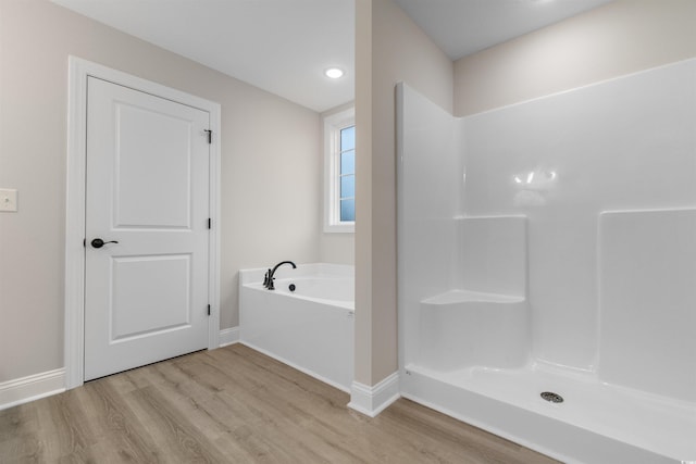 3329 Hughes Gasque Rd, Aynor, SC 29511 - full bathroom featuring wood finished floors, a garden tub, and a shower