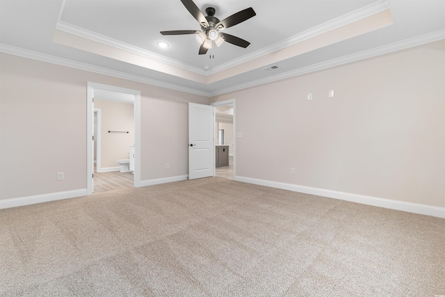 3329 Hughes Gasque Rd, Aynor, SC 29511 - unfurnished bedroom with a tray ceiling, ornamental molding, light colored carpet, recessed lighting, and ensuite bath