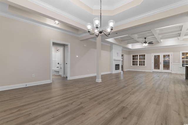 3329 Hughes Gasque Rd, Aynor, SC 29511 - unfurnished living room featuring a ceiling fan, wood finished floors, a chandelier, a large fireplace, and coffered ceiling