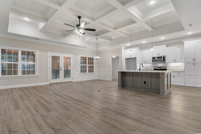 3329 Hughes Gasque Rd, Aynor, SC 29511 - unfurnished living room featuring beam ceiling, a ceiling fan, recessed lighting, coffered ceiling, and light wood-style floors