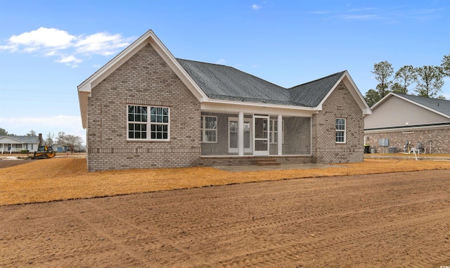 3329 Hughes Gasque Rd, Aynor, SC 29511 - back of house featuring brick siding and roof with shingles
