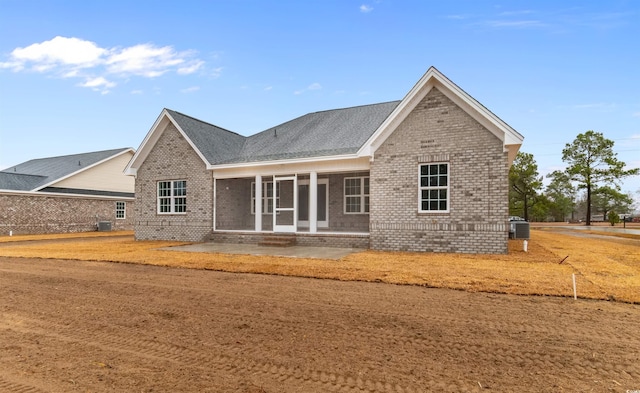 3329 Hughes Gasque Rd, Aynor, SC 29511 - view of front of home with brick siding, a patio area, and roof with shingles
