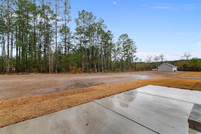 3329 Hughes Gasque Rd, Aynor, SC 29511 - view of yard featuring a patio and a wooded view