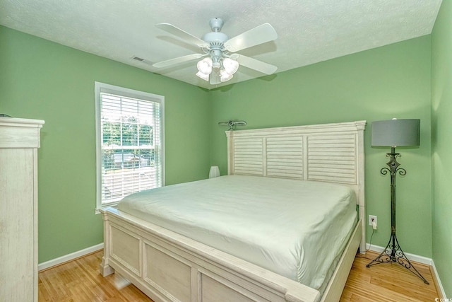 6001-1527 S Kings Hwy, Myrtle Beach, SC 29575 - bedroom with visible vents, baseboards, light wood-style floors, and a ceiling fan