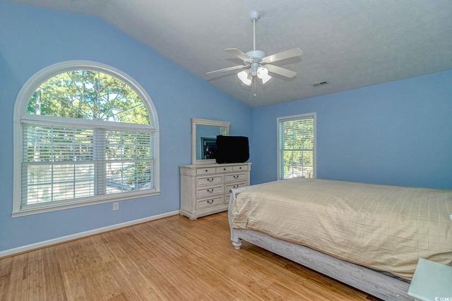 6001-1527 S Kings Hwy, Myrtle Beach, SC 29575 - bedroom with visible vents, baseboards, light wood-type flooring, lofted ceiling, and a textured ceiling