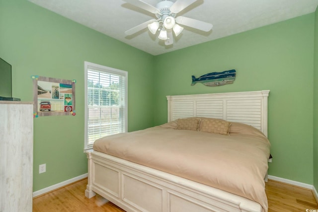 6001-1527 S Kings Hwy, Myrtle Beach, SC 29575 - bedroom with baseboards, light wood-style floors, and a ceiling fan