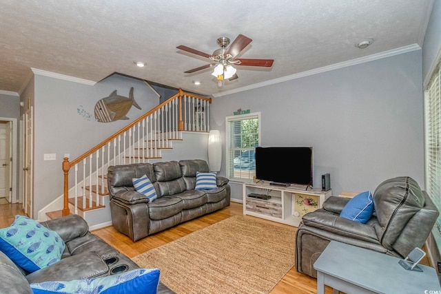 6001-1527 S Kings Hwy, Myrtle Beach, SC 29575 - living room featuring stairs, crown molding, a ceiling fan, and light wood-type flooring