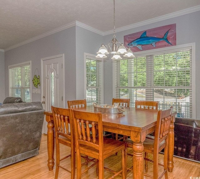 6001-1527 S Kings Hwy, Myrtle Beach, SC 29575 - dining space featuring a notable chandelier, crown molding, and light wood-type flooring