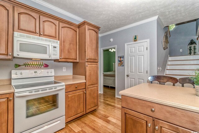 6001-1527 S Kings Hwy, Myrtle Beach, SC 29575 - kitchen featuring light wood-type flooring, white appliances, brown cabinetry, and light countertops