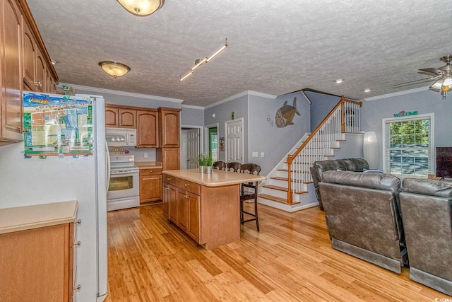 6001-1527 S Kings Hwy, Myrtle Beach, SC 29575 - kitchen with open floor plan, white appliances, a breakfast bar, and light wood-style floors