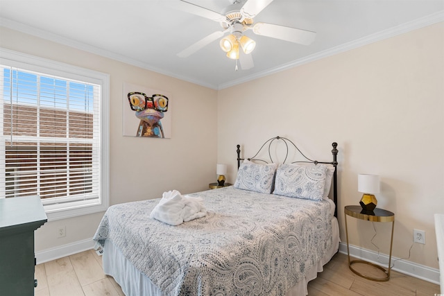 bedroom with crown molding, baseboards, ceiling fan, and light wood-style floors