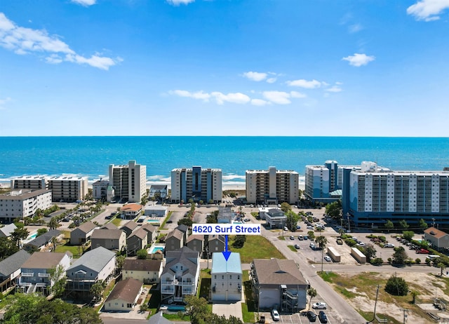 bird's eye view featuring a view of city and a water view