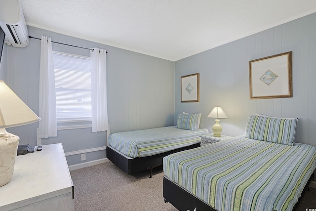 bedroom with baseboards, an AC wall unit, and carpet