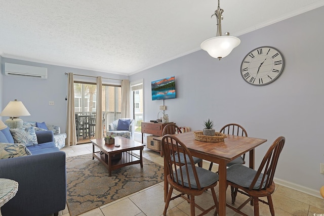 dining room with baseboards, a textured ceiling, ornamental molding, and a wall unit AC