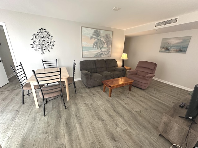 5905 S Kings Hwy Unit 1116, Myrtle Beach, SC 29575 - living area featuring visible vents, baseboards, and wood finished floors