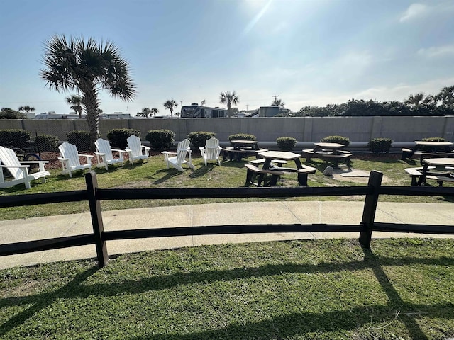 5905 S Kings Hwy Unit 1116, Myrtle Beach, SC 29575 - view of yard with an outdoor fire pit and a fenced backyard