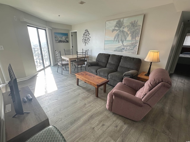 5905 S Kings Hwy Unit 1116, Myrtle Beach, SC 29575 - living room featuring baseboards, wood-type flooring, and visible vents