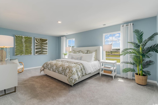 carpeted bedroom with baseboards and recessed lighting