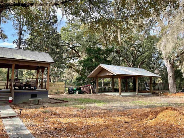 view of home's community with a gazebo and fence