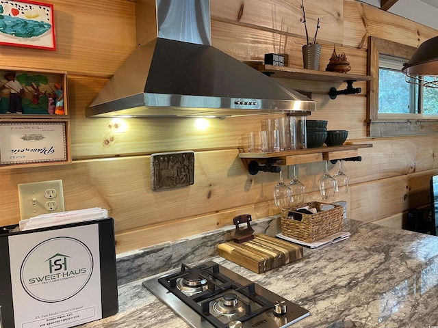kitchen with open shelves, wall chimney exhaust hood, and stainless steel gas cooktop