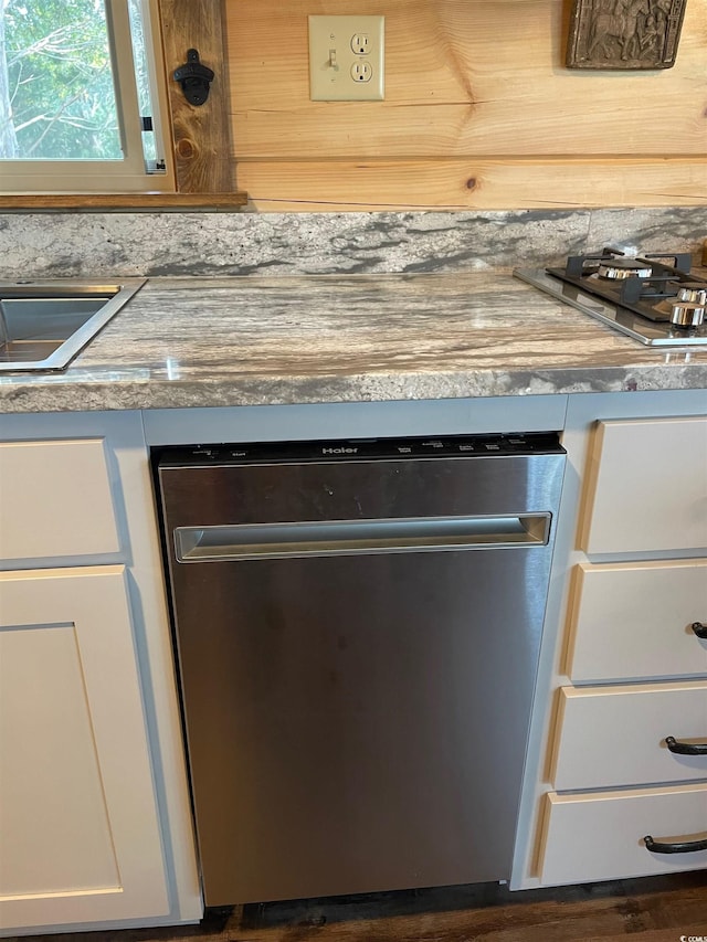 room details with white cabinets and stainless steel appliances