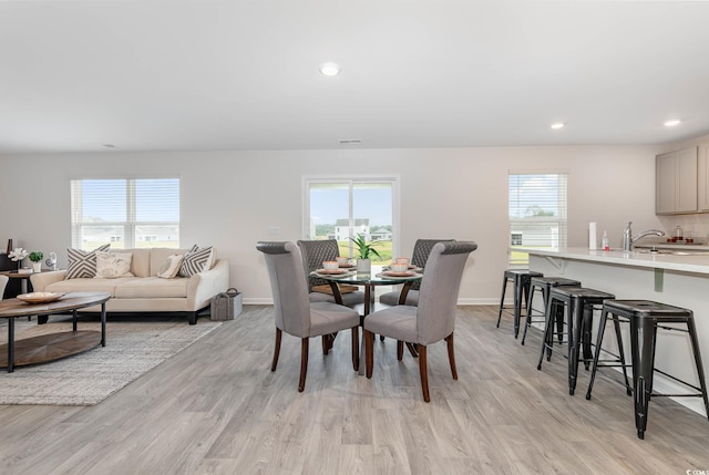 4484 E Coast Ln, Shallotte, NC 28470 - dining space with light wood-type flooring, baseboards, and recessed lighting