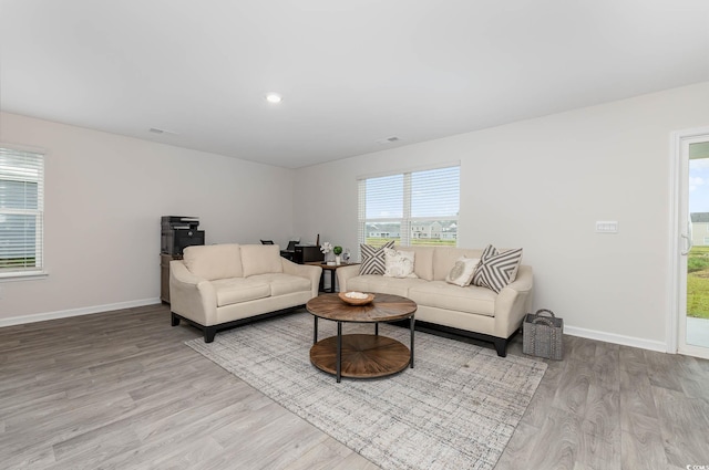 4484 E Coast Ln, Shallotte, NC 28470 - living area featuring wood finished floors, baseboards, and recessed lighting