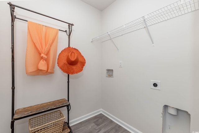 4484 E Coast Ln, Shallotte, NC 28470 - laundry area featuring washer hookup, wood finished floors, baseboards, and electric dryer hookup