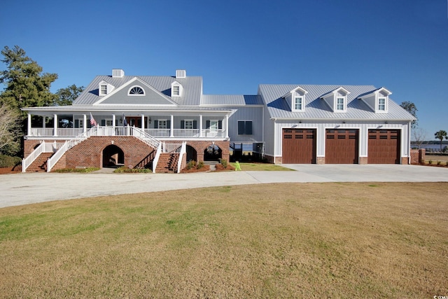 2425 S Bay St, Georgetown, SC 29440 - view of front of house with stairs, a porch, concrete driveway, and a front yard