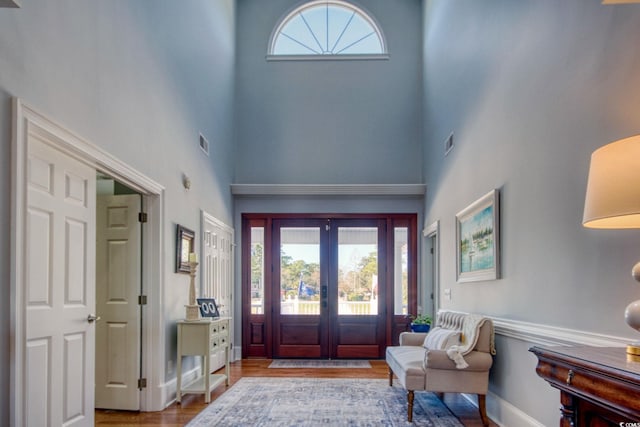 2425 S Bay St, Georgetown, SC 29440 - foyer featuring a towering ceiling, french doors, wood finished floors, and baseboards