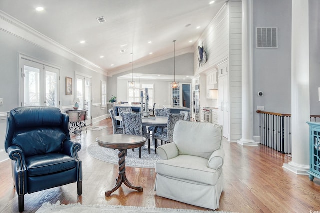 2425 S Bay St, Georgetown, SC 29440 - living area with vaulted ceiling, light wood-style floors, crown molding, baseboards, and recessed lighting