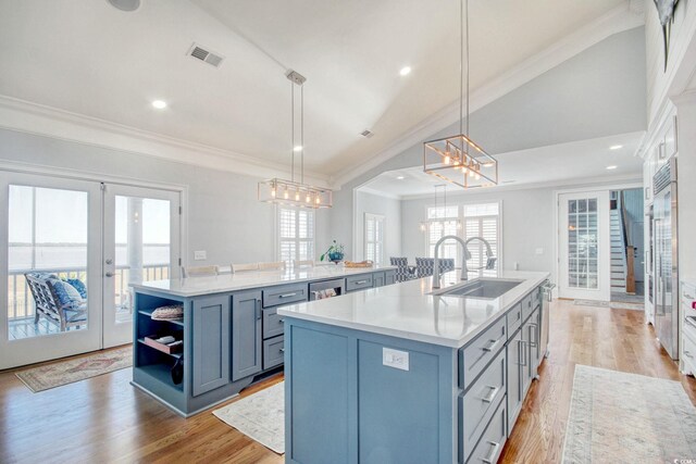 2425 S Bay St, Georgetown, SC 29440 - kitchen featuring a large island, french doors, crown molding, open shelves, and lofted ceiling