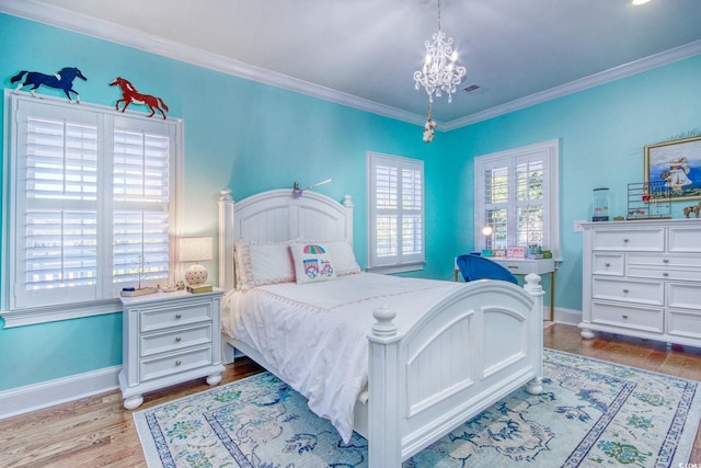 2425 S Bay St, Georgetown, SC 29440 - bedroom featuring a chandelier, wood finished floors, crown molding, and baseboards