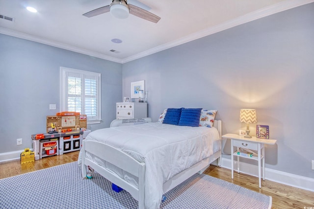 2425 S Bay St, Georgetown, SC 29440 - bedroom with wood finished floors, baseboards, crown molding, and ceiling fan