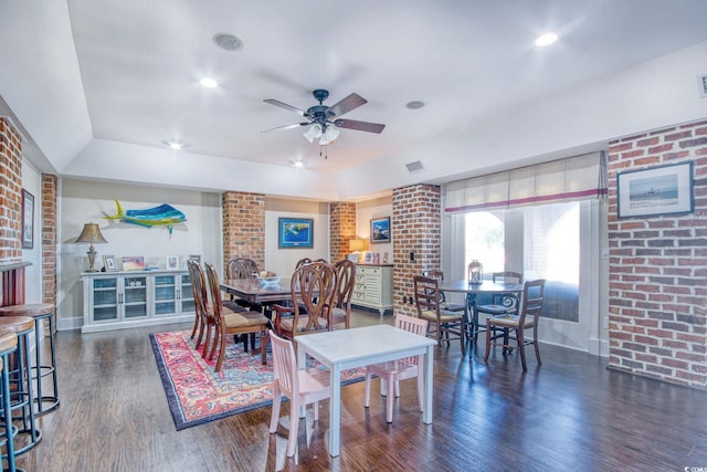 2425 S Bay St, Georgetown, SC 29440 - dining space featuring wood finished floors, ceiling fan, brick wall, a raised ceiling, and baseboards