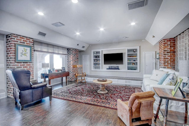 2425 S Bay St, Georgetown, SC 29440 - living room with vaulted ceiling, wood finished floors, built in shelves, and baseboards