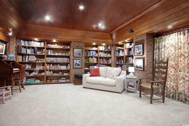2425 S Bay St, Georgetown, SC 29440 - living area with carpet flooring, wooden ceiling, wood walls, and built in shelves